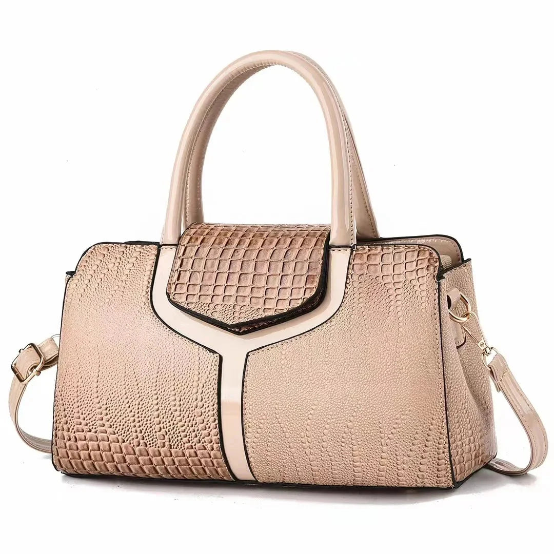Women's structured brown embossed leather satchel bag with polished silhouette for everyday use