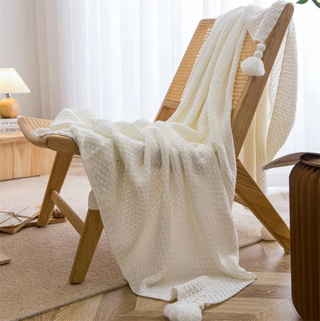 Cream handknit Nordic throw blanket with tassel fringe, ultra-soft breathable cozy style for beds