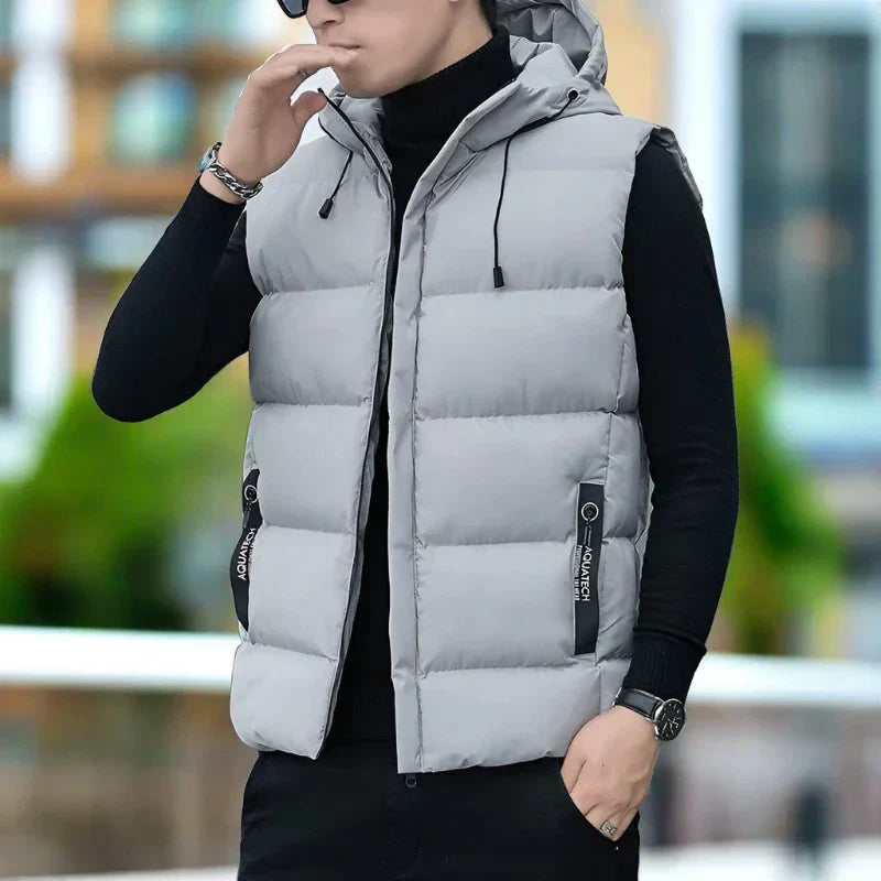 Men's slim fit quilted hooded vest with zipper pockets, lightweight insulated layer in modern silhouette