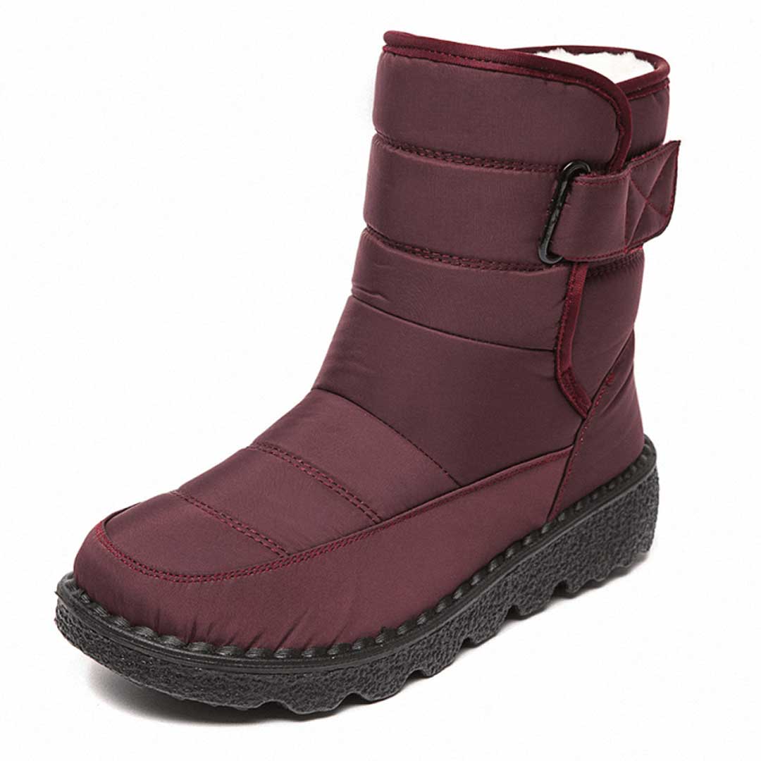 Women's mid-calf quilted winter boots with insulated lining and velcro strap closure