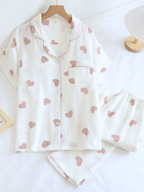 Women's pink heart print short sleeve pajama set with relaxed fit for cozy sleepwear