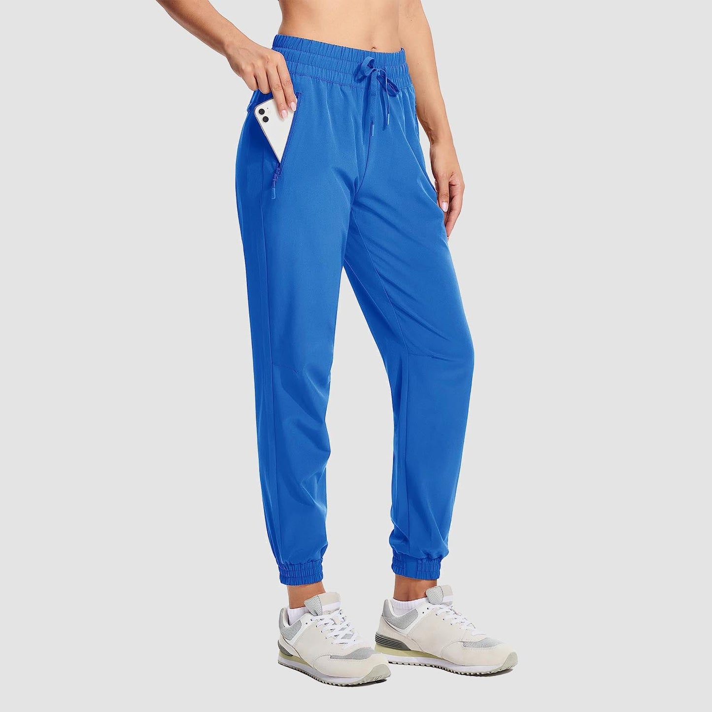 Women's lightweight gray hiking joggers with 4-way stretch, water-resistant fabric, and secure pockets