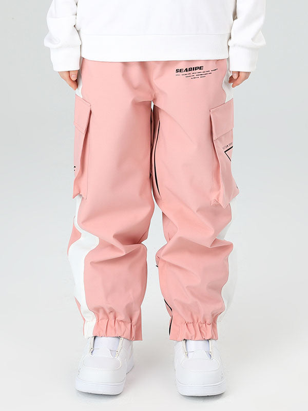 Women's oversized cargo snow pants in neutral tones, waterproof breathable with built-in gaiters