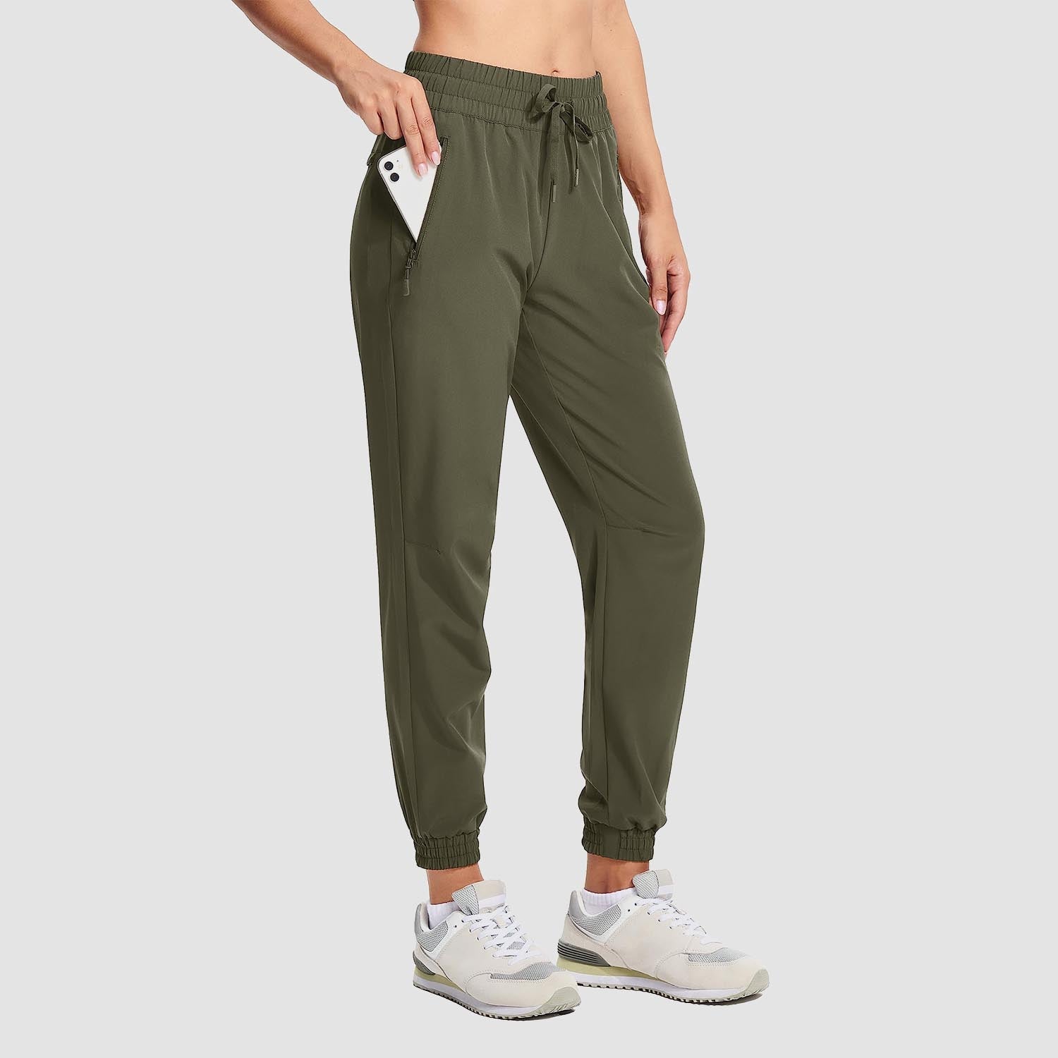 Women's lightweight gray hiking joggers with 4-way stretch, water-resistant fabric, and multi-pocket design