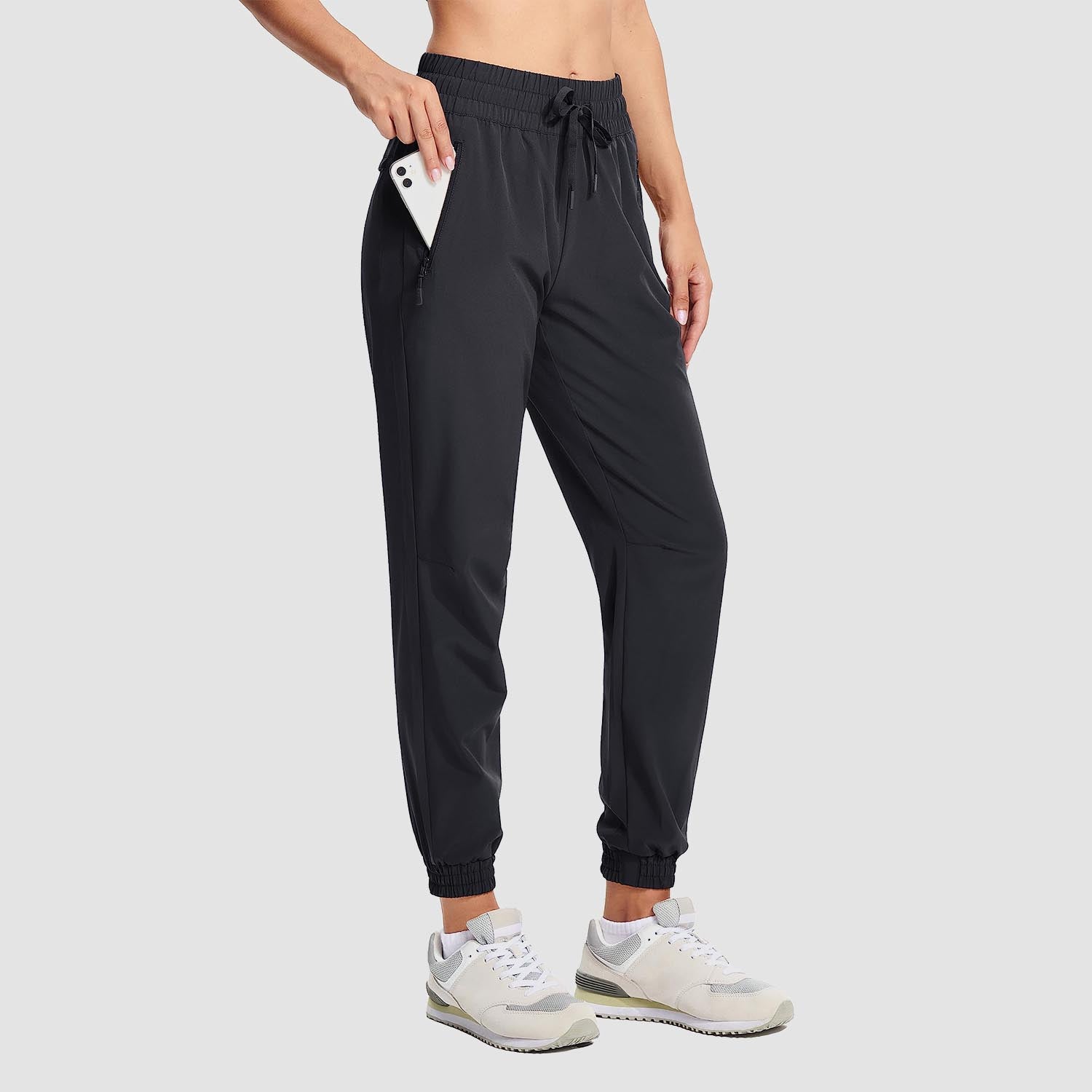 Women's lightweight gray hiking joggers with 4-way stretch, water-resistant fabric, and multiple pockets