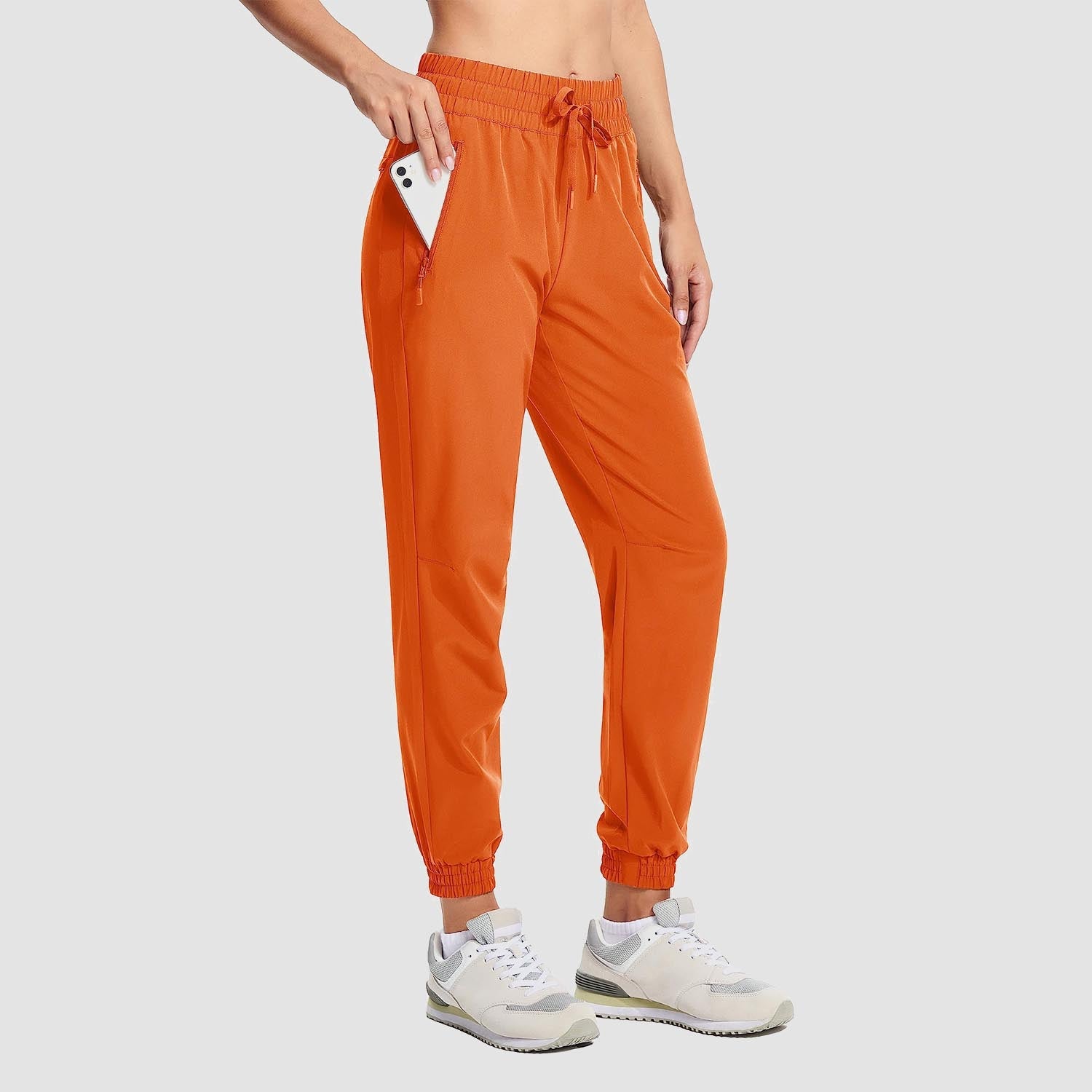 Women's lightweight gray hiking joggers with 4-way stretch, water-resistant fabric, and side pockets