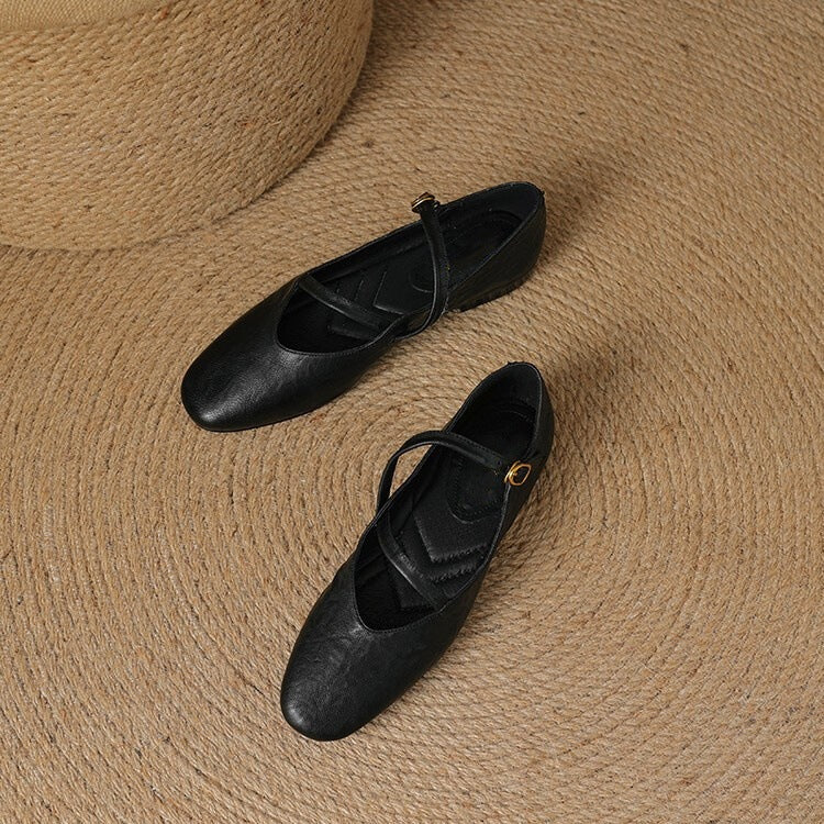 Women's black closed-toe Mary Jane flats with adjustable buckle strap for all-day comfort