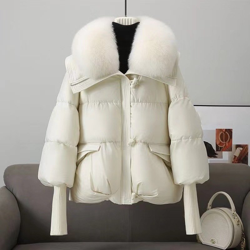 Women's oversized quilted jacket black hip-length with luxurious faux fur collar for winter