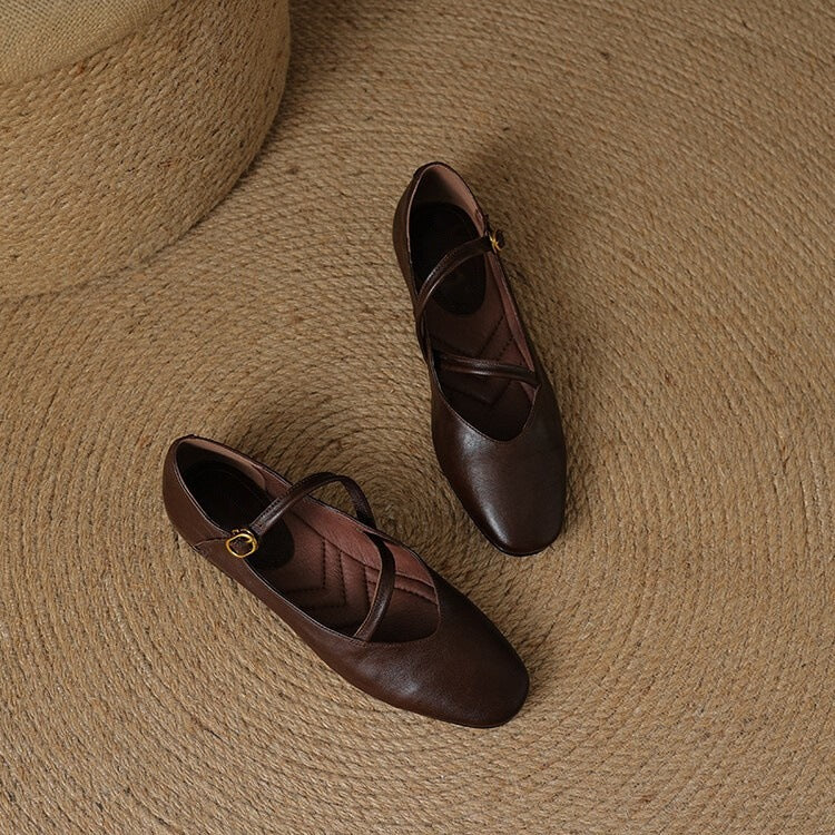 Women's black closed-toe Mary Jane flats with adjustable buckle strap for all-day comfort