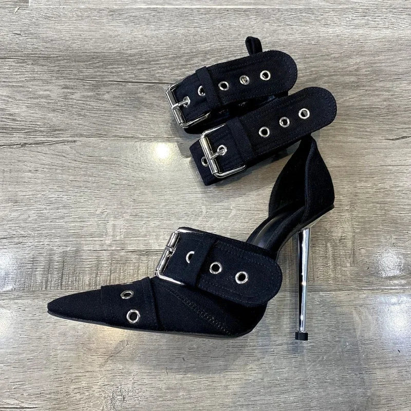 Metallic silver stiletto pumps with pointed toe and punk-rock buckle detail for bold nightlife style