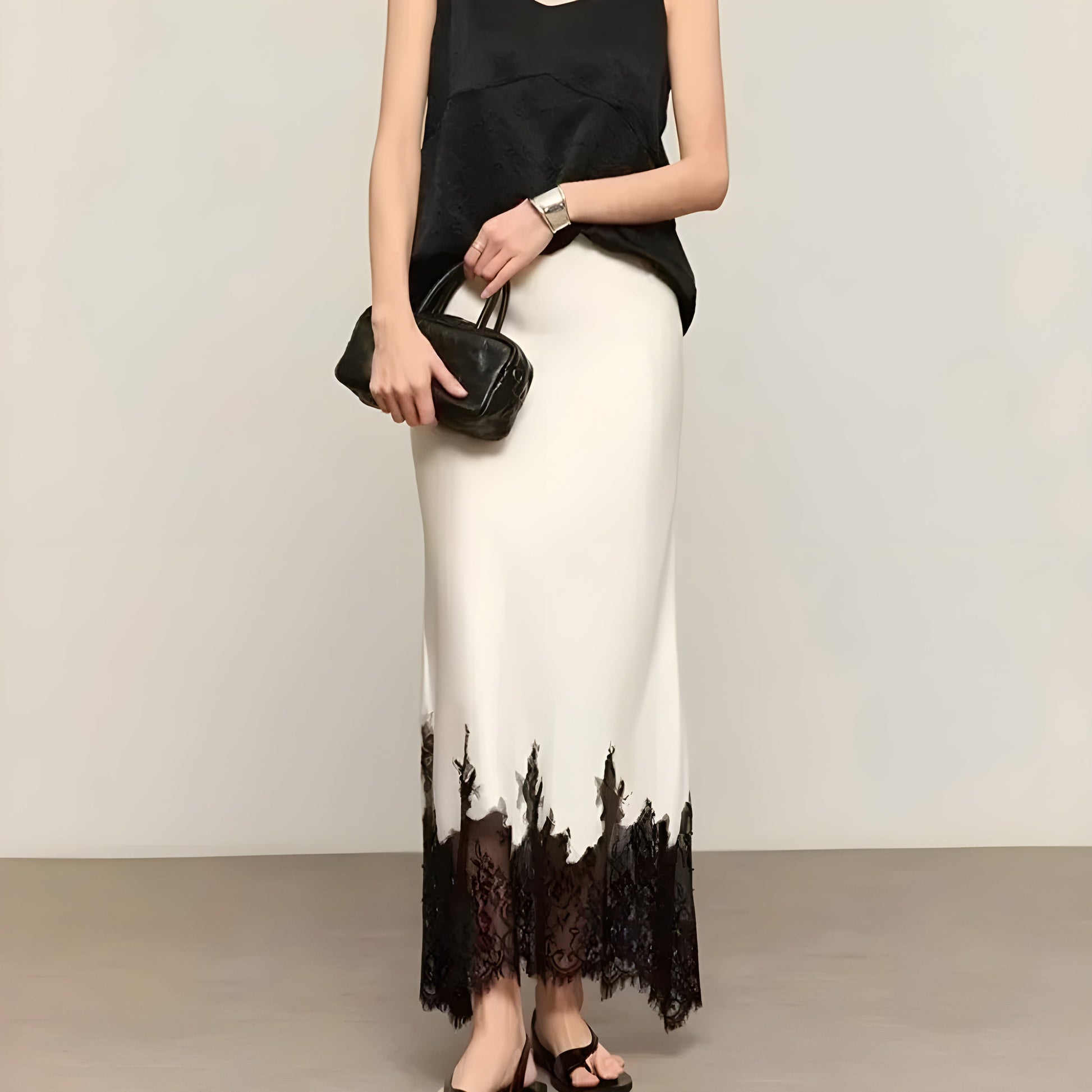 Women's flowing midi skirt with delicate lace trim, elegant silhouette for work and special occasions