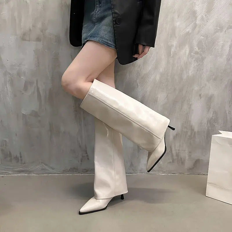 Women's black leather thigh-high boots sleek structured silhouette with refined buckle detail