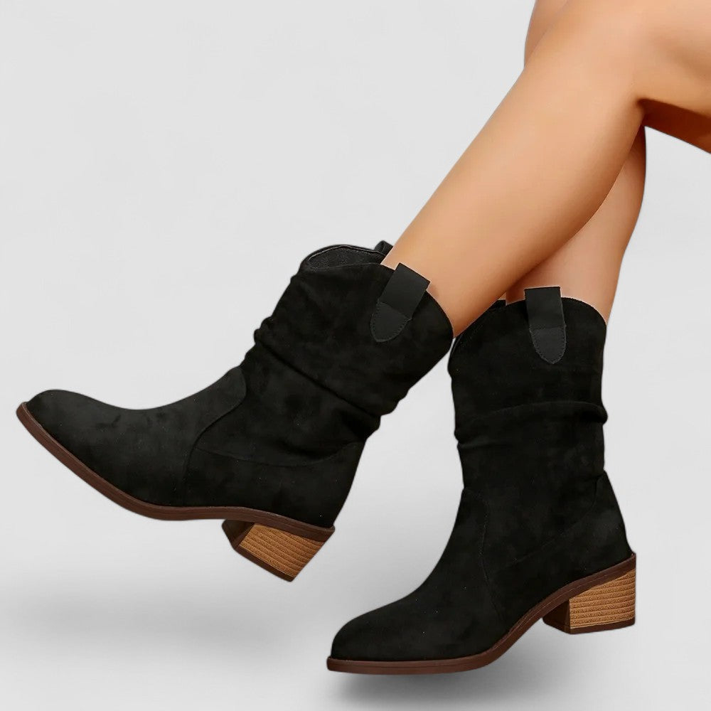 Women's western mid-calf boots with low block heel, smooth finish, and soft slouch shaft detail