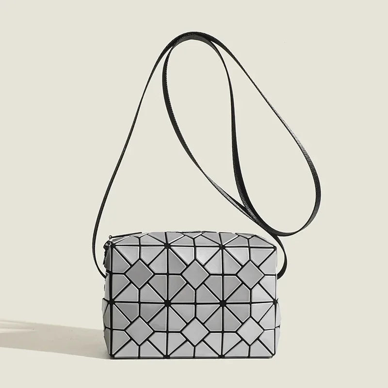 Geometric matte finish shoulder sling bag modern sculptural silhouette roomy zip closure daily commute