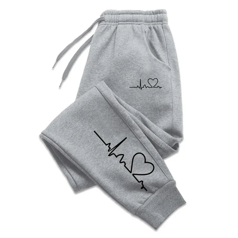 Women's gray lounge sweatpants with elegant tapered fit and elastic waistband for premium comfort