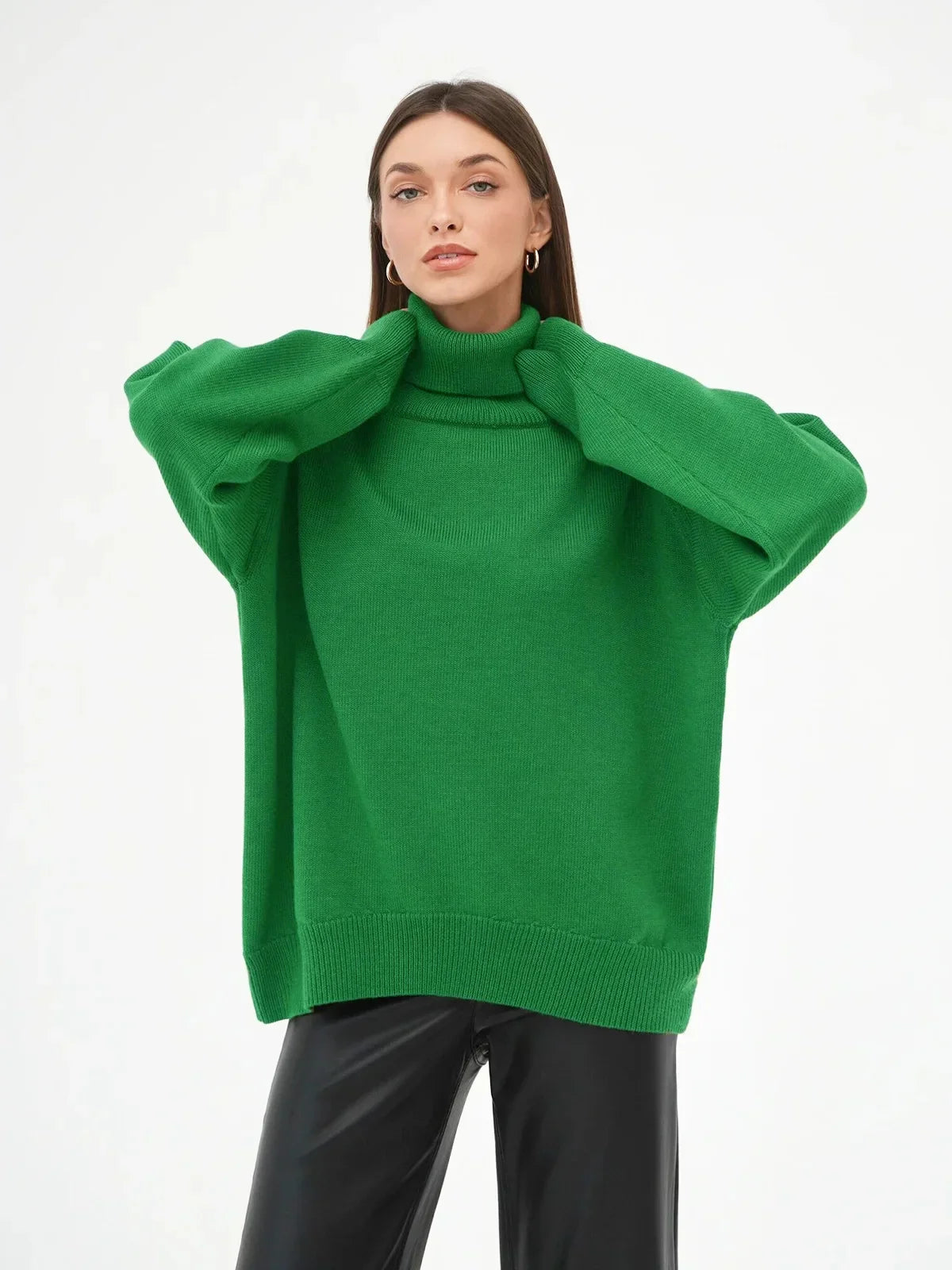 Women's oversized ivory knit turtleneck sweater with ribbed detail and relaxed cozy silhouette