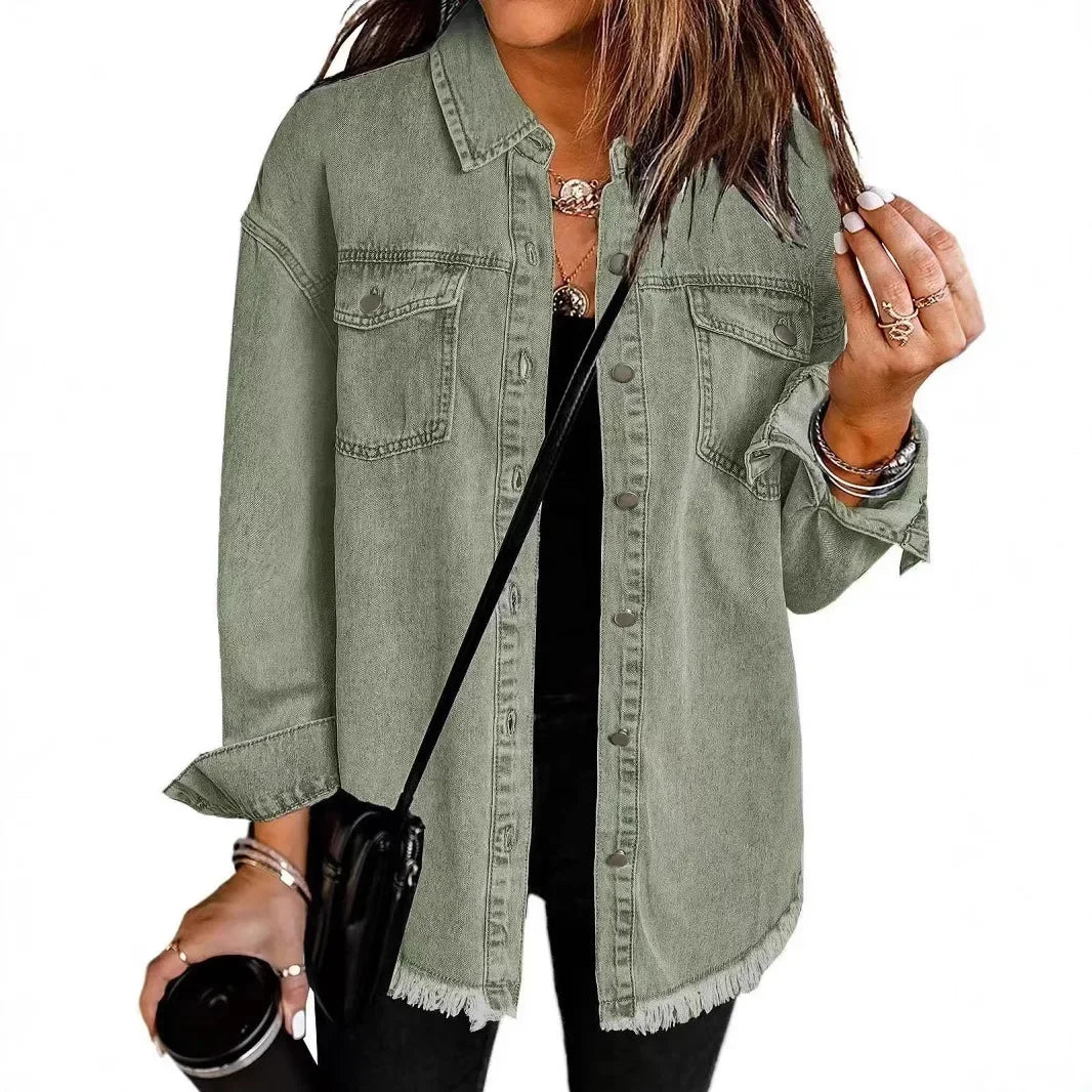 Women's relaxed fit washed denim shirt jacket with button-down front, chest pockets, and fringe hem