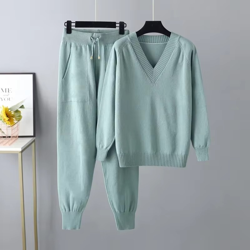 Women's knitted V-neck sweater and pants two-piece set in soft autumn-winter tones with relaxed cozy fit