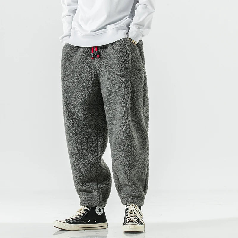 Men's slim tapered jogger pants with elastic waistband and side pockets for cool weather comfort
