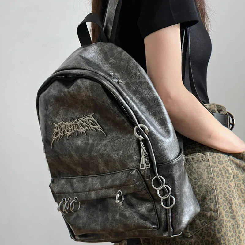 Gray canvas gothic backpack with metal ring accents, large capacity dark aesthetic raven design