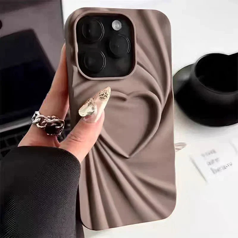 Ultra-slim matte silicone iPhone case with 3D sculpted folded heart design, full coverage protection for women