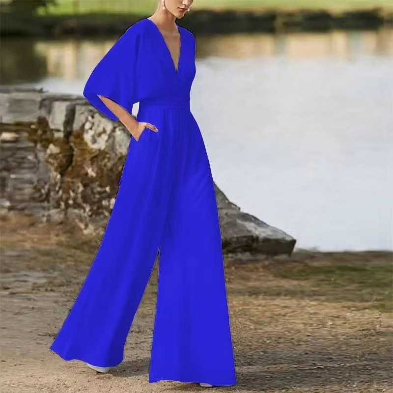Women's solid color low waist wide-leg jumpsuit with side button closure, long elegant silhouette