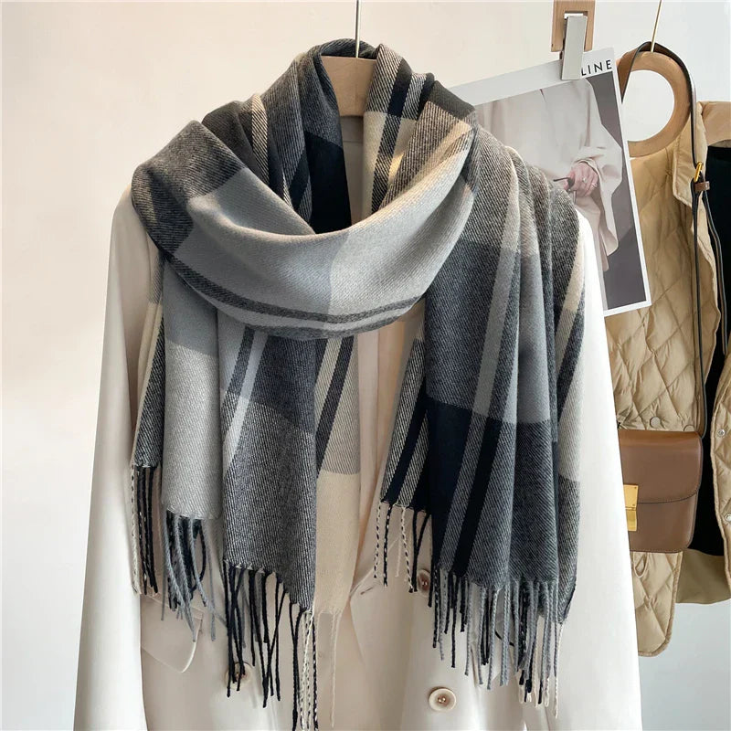 Women's oversized wool-blend scarf in classic check pattern with elegant fringed edges for fall