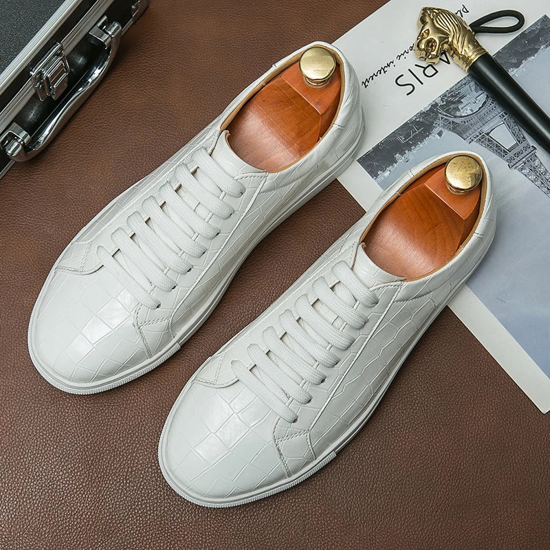 Men's white low-top leather sneaker with subtle alligator embossing and cushioned comfort sole