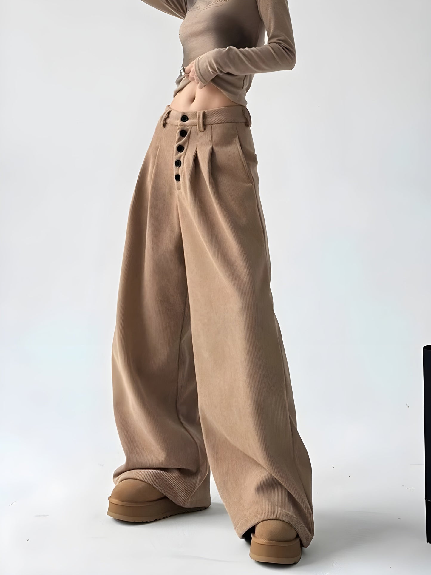 Women's corduroy palazzo pants cinched high waist wide leg silhouette with button detail