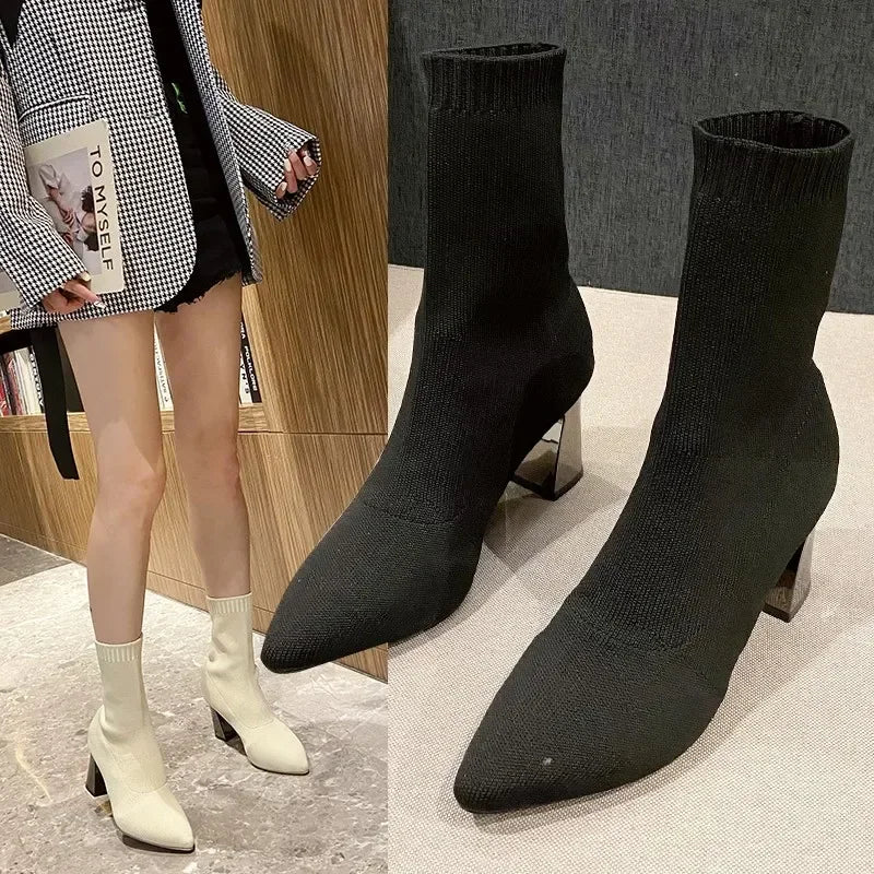 Women's black leather orthopedic sock boots with pointed toe and stretchy slip-on fit