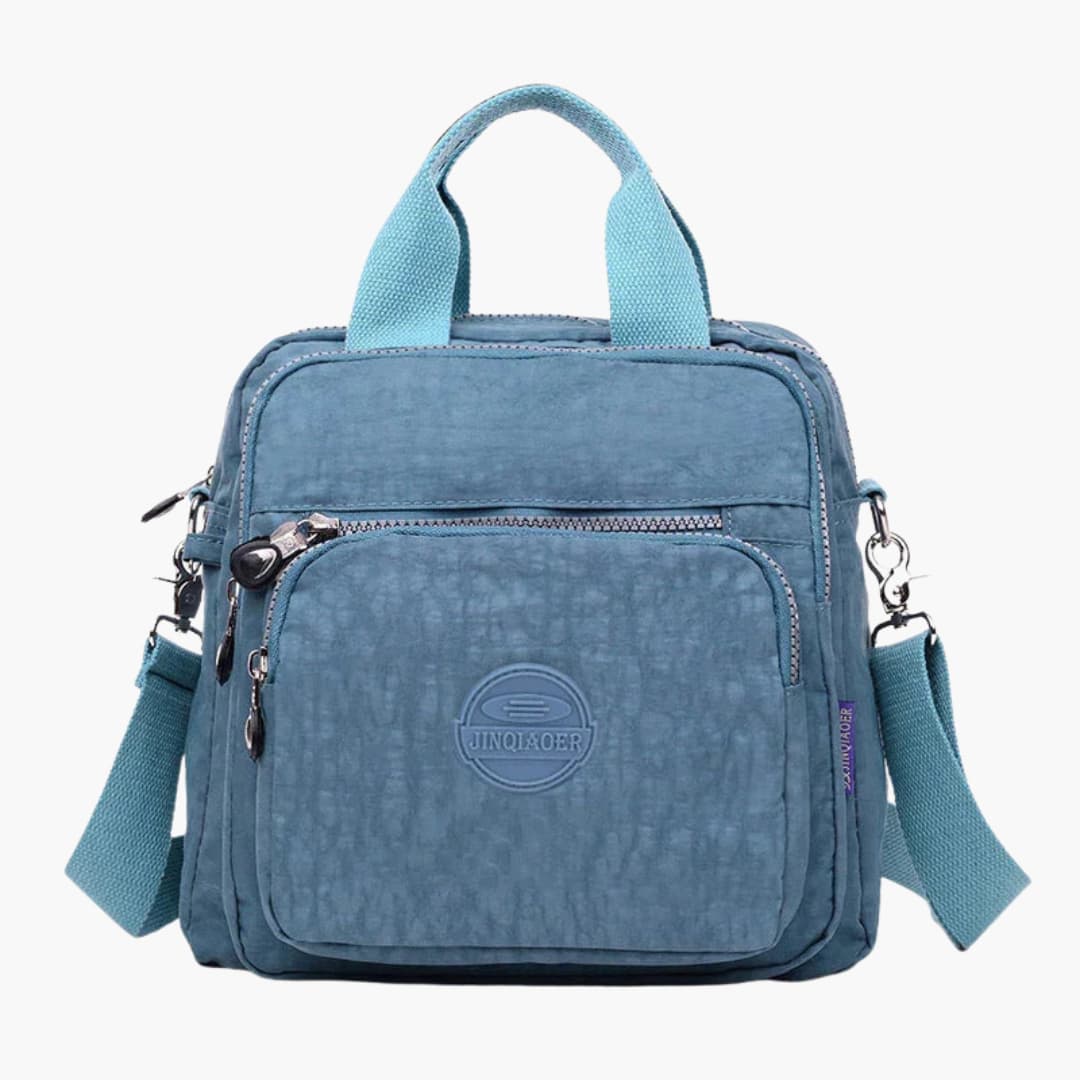Women's minimalist shoulder bag adjustable crossbody strap multiple pockets sleek everyday travel versatile