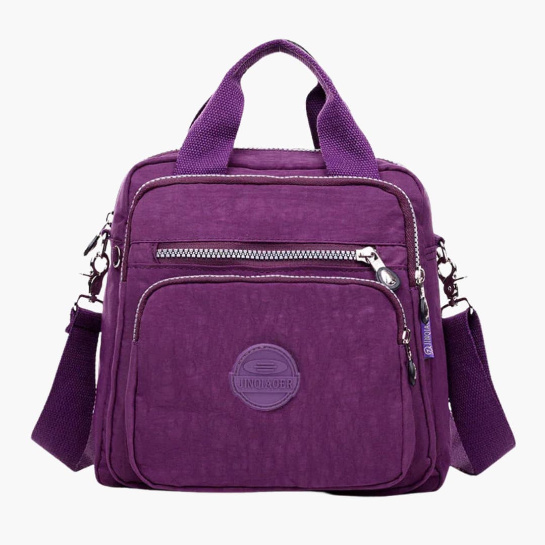 Women's minimalist shoulder bag with adjustable strap, multiple pockets, sleek crossbody design for travel