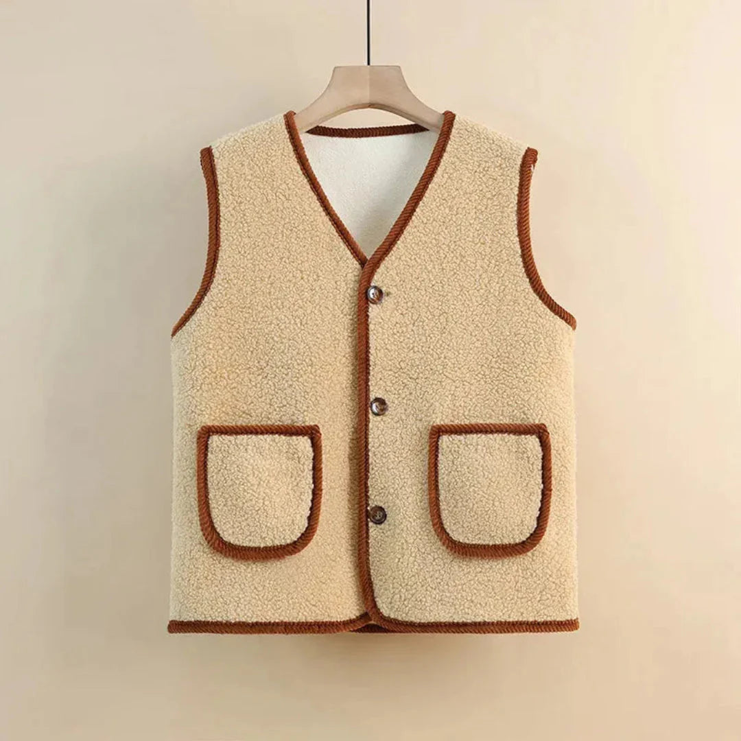 Women's wool blend sherpa vest in neutral, sleeveless V-neck style with cozy plush texture and button front