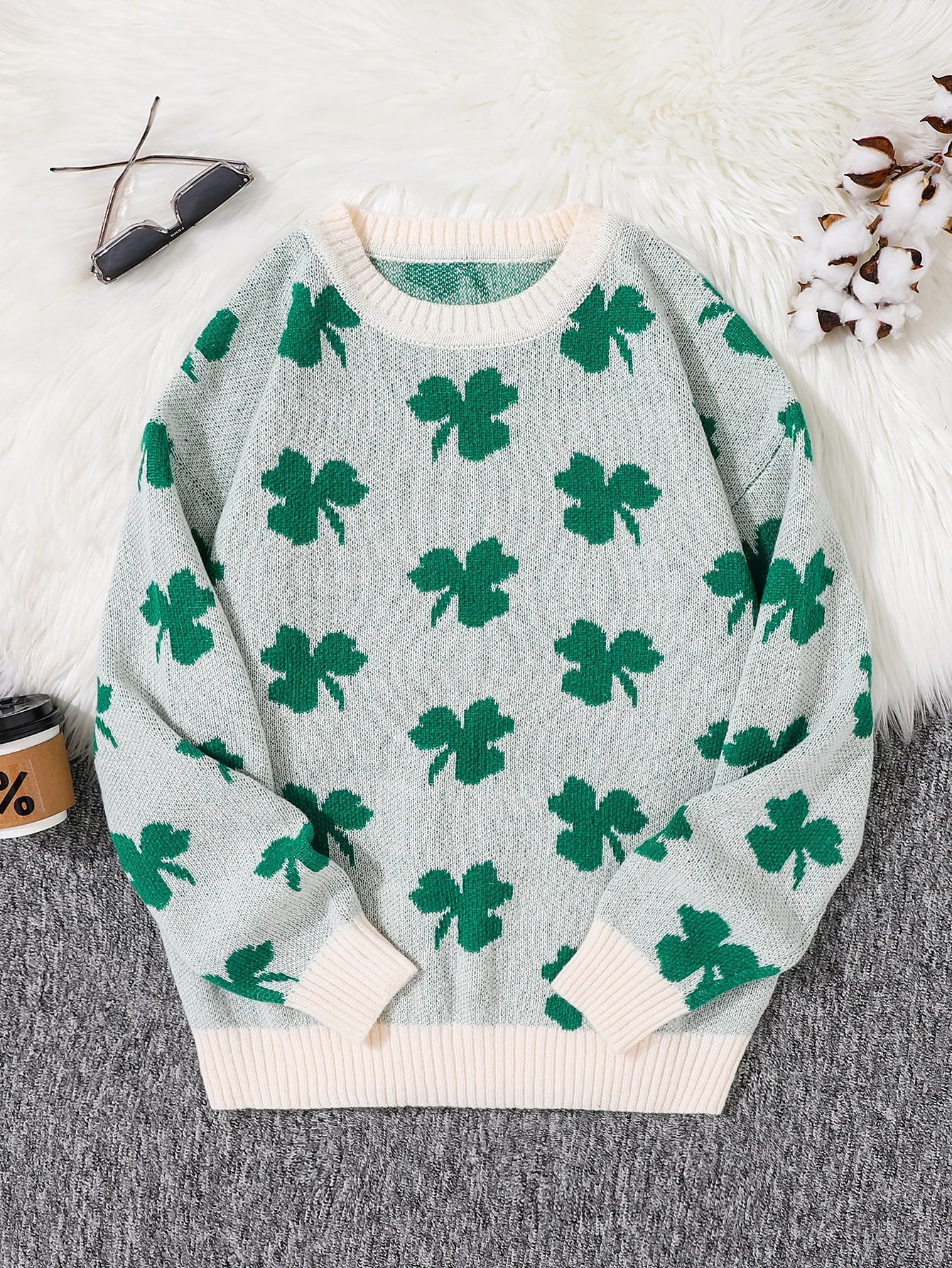 Women's cream crew neck knit sweater with all-over green clover pattern, lightweight seasonal layering piece