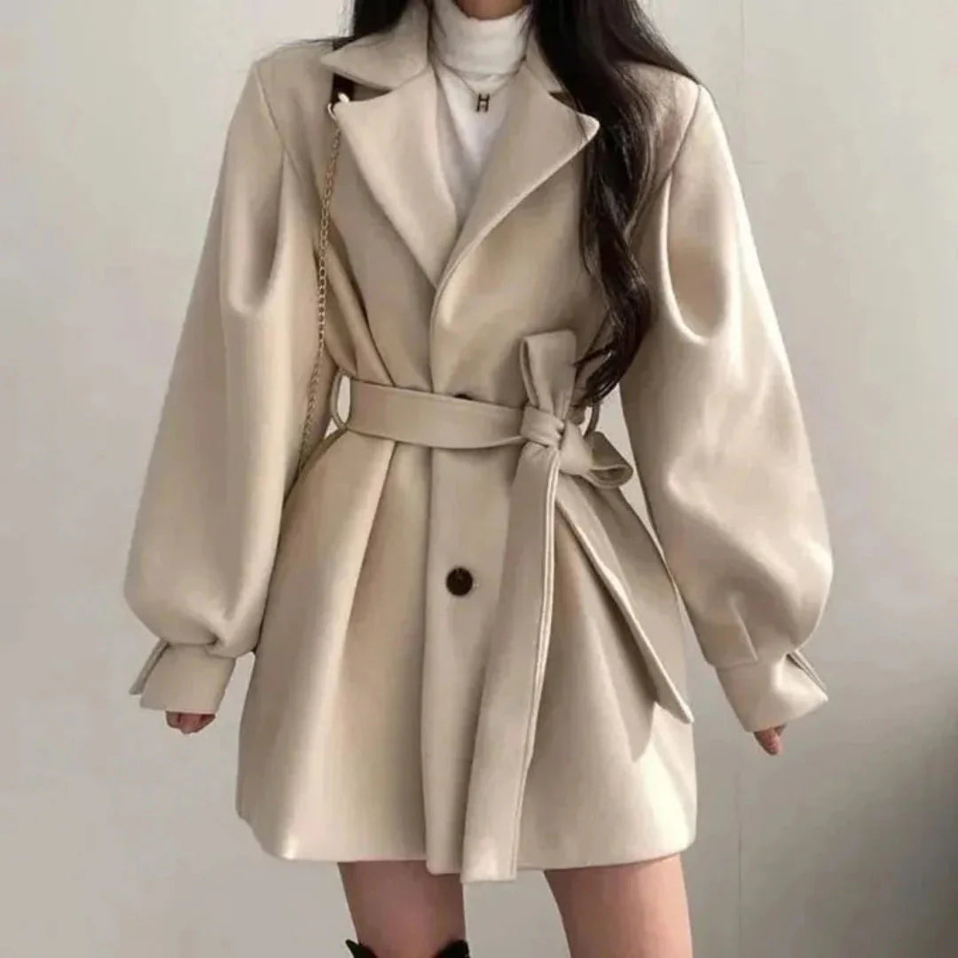 Beige lantern sleeve trench coat with adjustable waist belt, Italian-inspired tailored silhouette