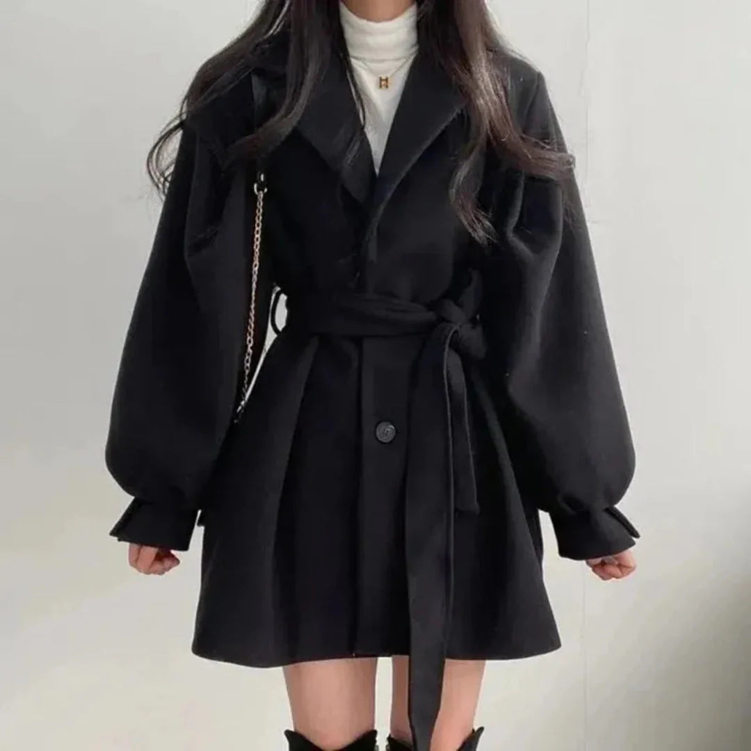 Beige lantern sleeve trench coat with adjustable waist belt, Italian-inspired elegant tailored silhouette