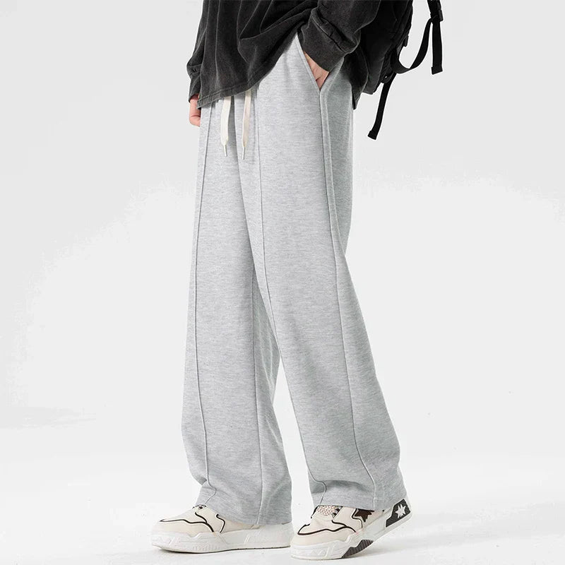 Gray relaxed straight-leg sweatpants with minimal stripe detail, midweight cotton blend for gym and lounge
