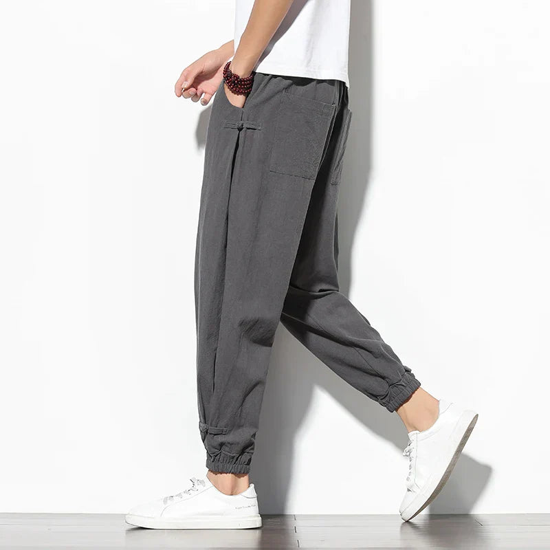 Toka relaxed tapered cotton-blend pants in neutral tone with adjustable drawstring waist