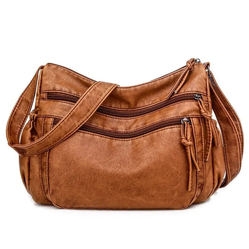 Harlow vegan leather crossbody bag in minimalist silhouette with adjustable strap and organized compartments