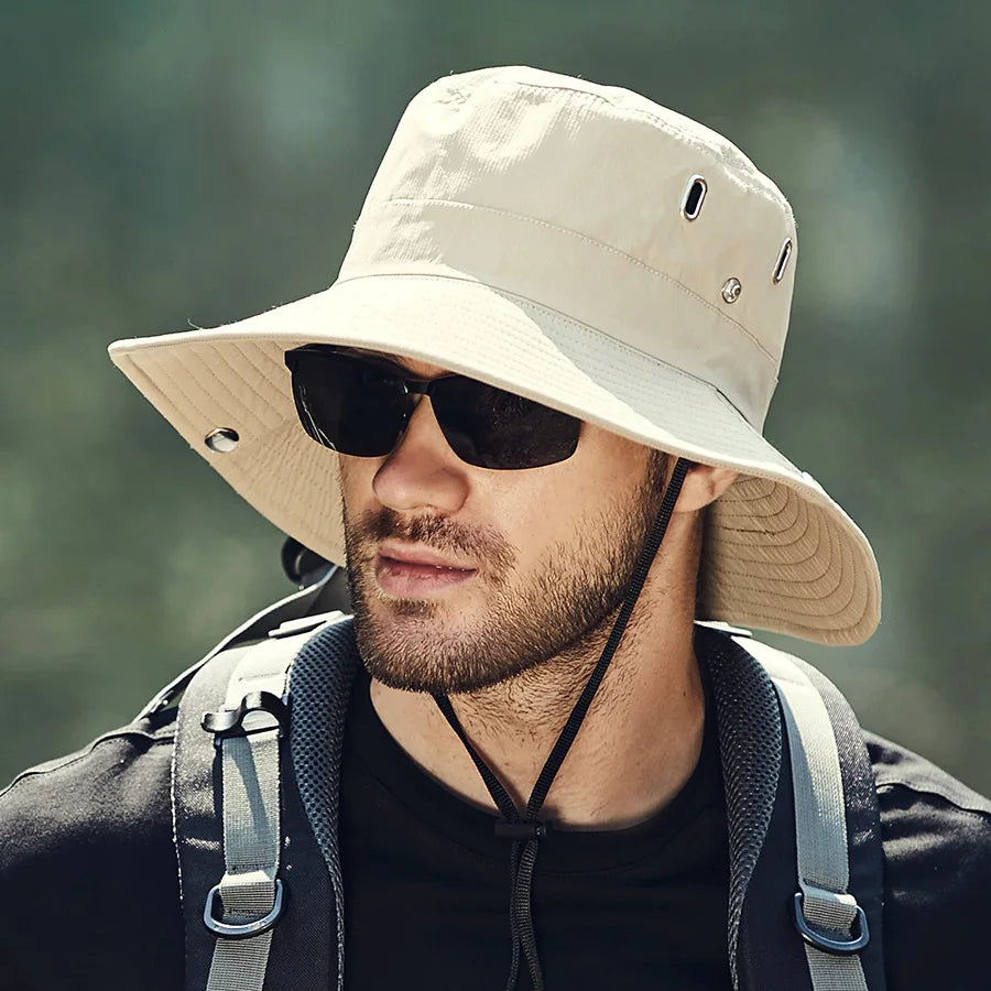 Packable wide brim sun hat with neck flap, breathable perforations, and moisture-wicking sweatband