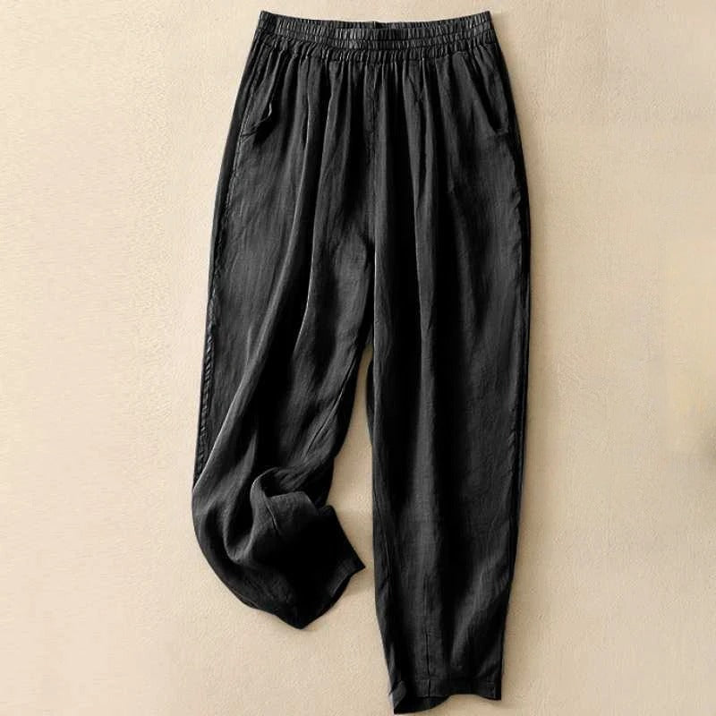 Sage green women's linen blend pants with elastic waist, fluid drape, and side pockets