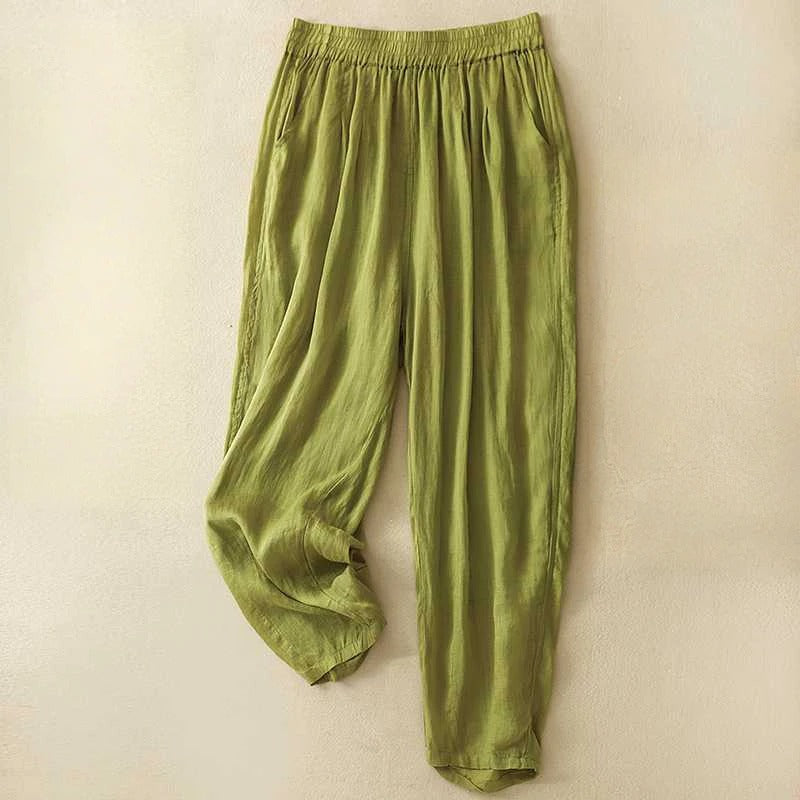 Sage green linen blend women's pants with elastic waist, fluid drape, and side pockets