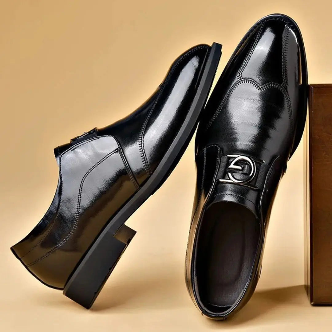 Salvatore Regal men's black leather dress shoes with sleek silhouette and distinctive buckle detail