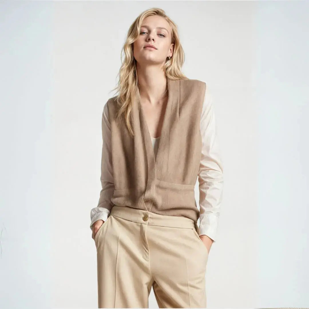 Women's sleeveless wrap vest in neutral tone, lightweight gilet with cinch waist tie and deep V-neckline