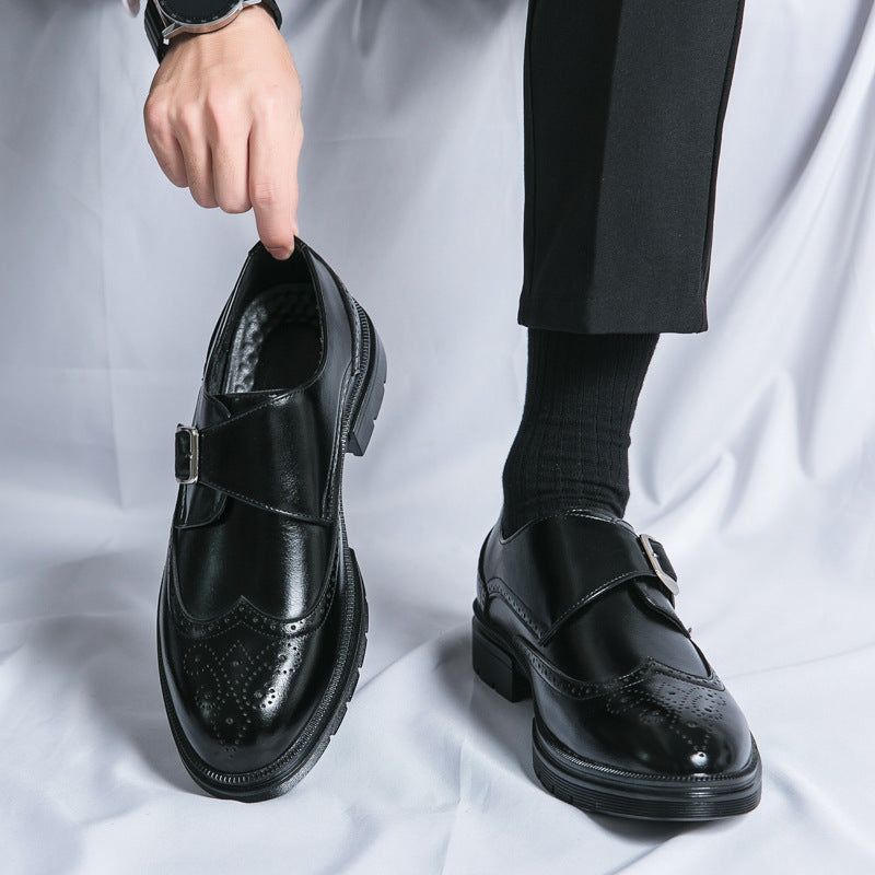 Brown leather monk strap dress shoes with single buckle closure and classic wingtip detailing