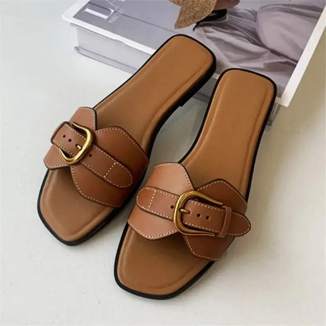 Women's square toe flat slides with wide faux leather strap and gold buckle accent, slip-on style