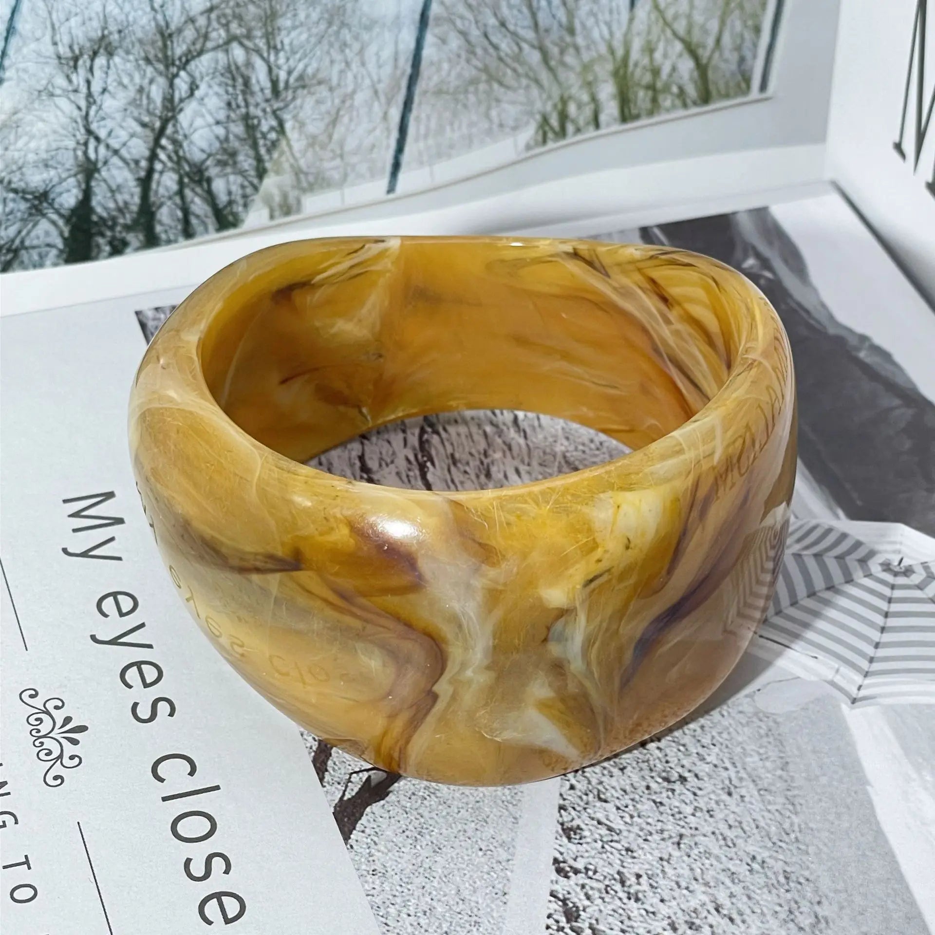 Genevieve marble-patterned acrylic bangle irregular silhouette stackable statement bracelet lightweight
