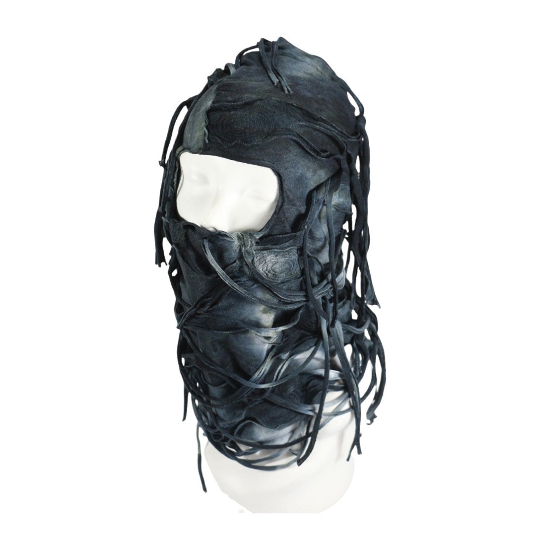 Black cotton dystopian hood headpiece with layered urban rebel design and twisted rope fringe accents