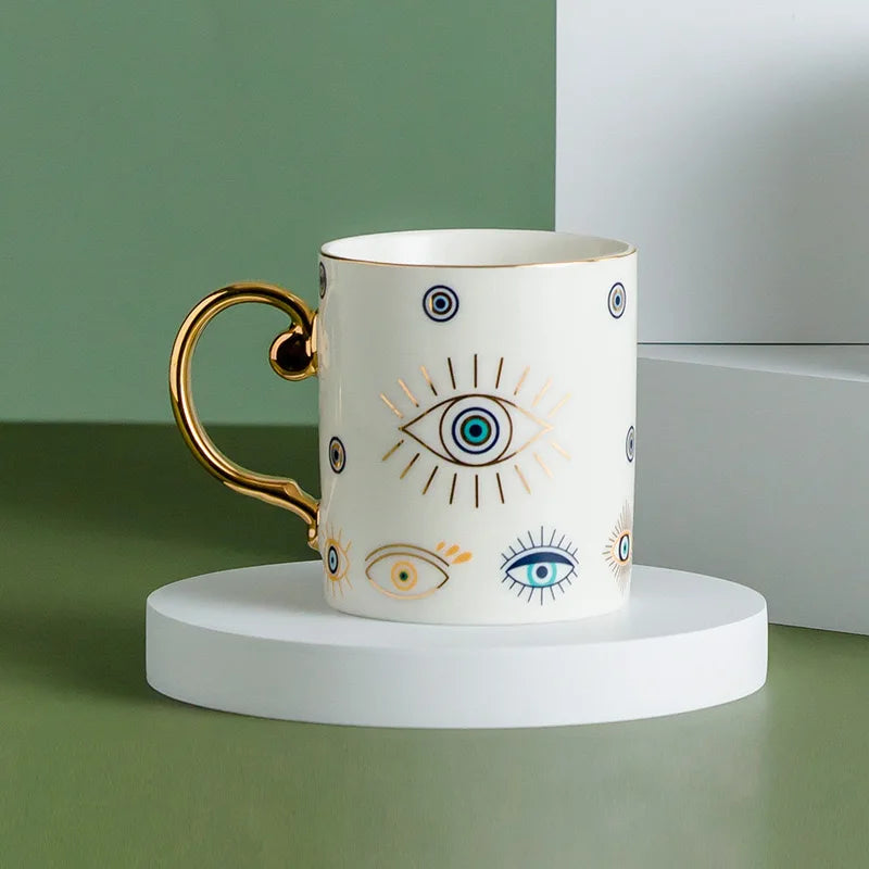 Evil Eye ceramic coffee mug gold trim Turkish craft positivity protection mystique design