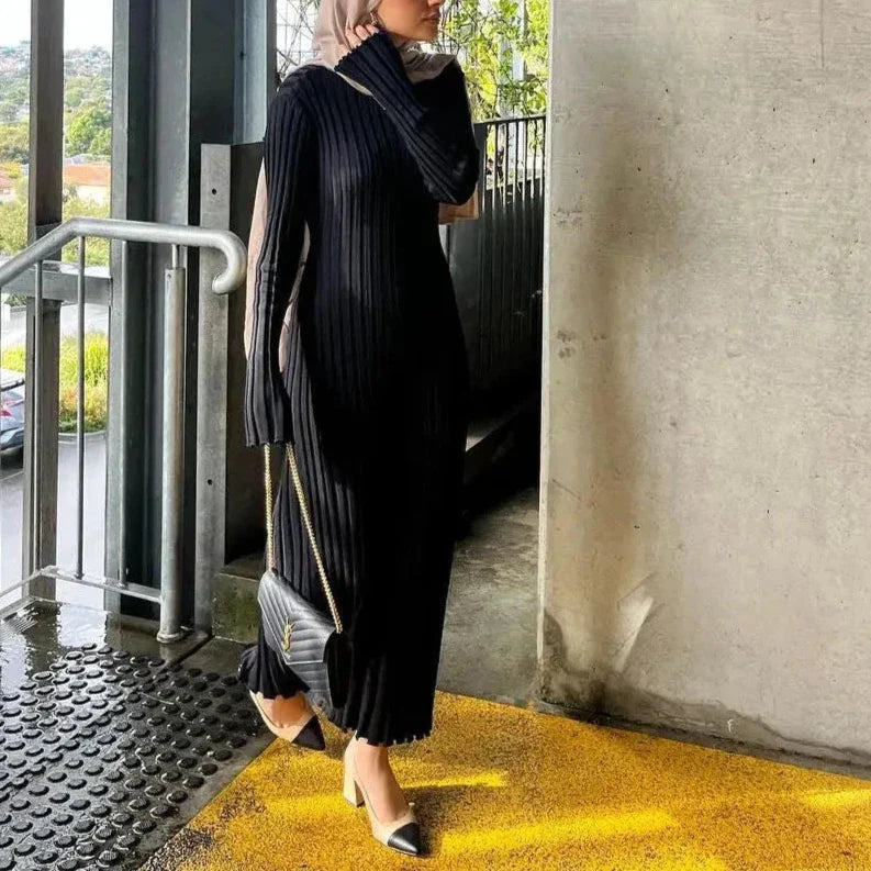 Soft knit maxi dress with high waist and optional lace-up detail for effortlessly chic style